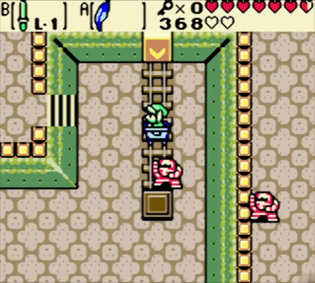 Link in the cart at the end of the track with two Ropes nearby Link in the cart at the end of the track with two Ropes nearby