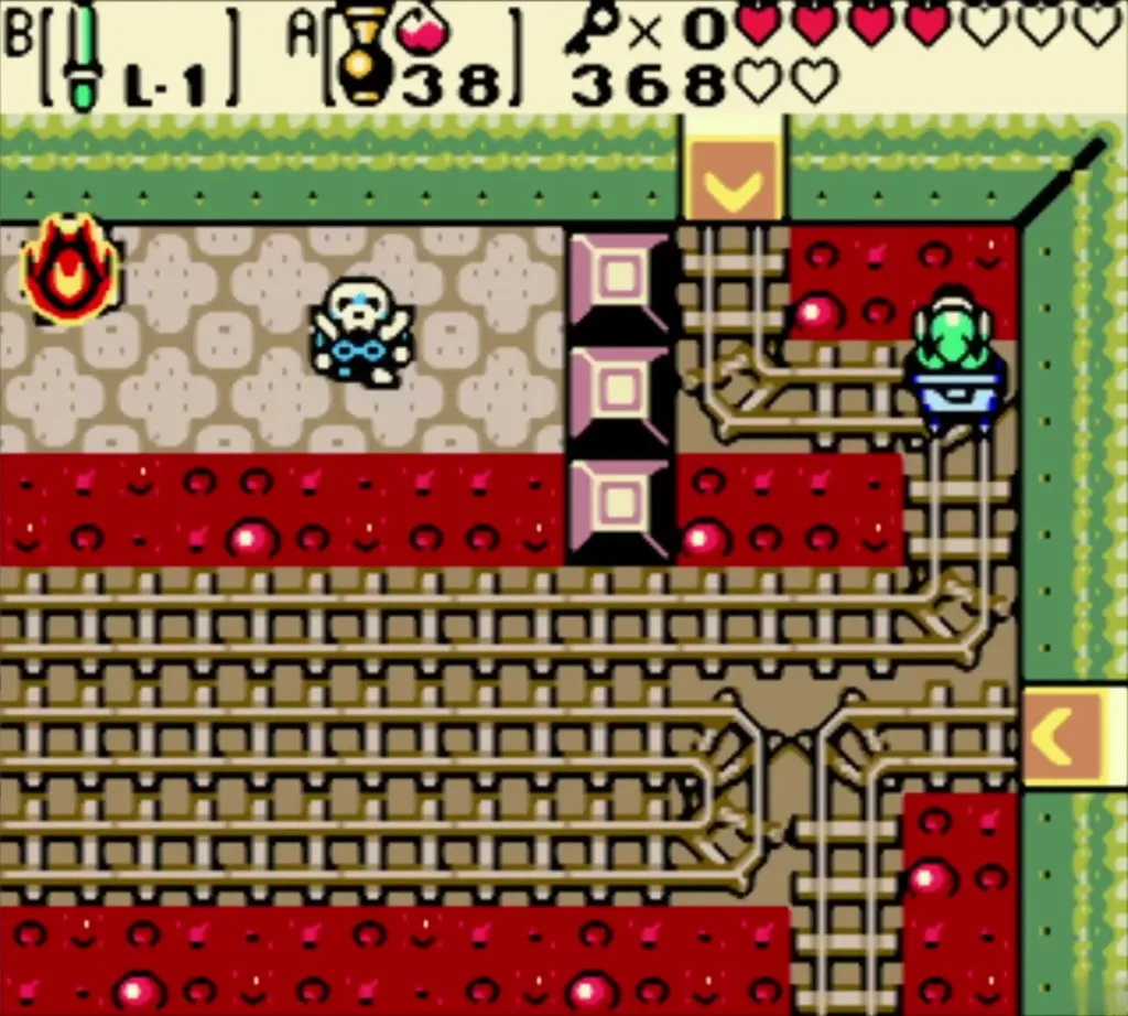 Link in the cart on the long track beside a Stalfos and a fire bat Link in the cart on the long track beside a Stalfos and a fire bat