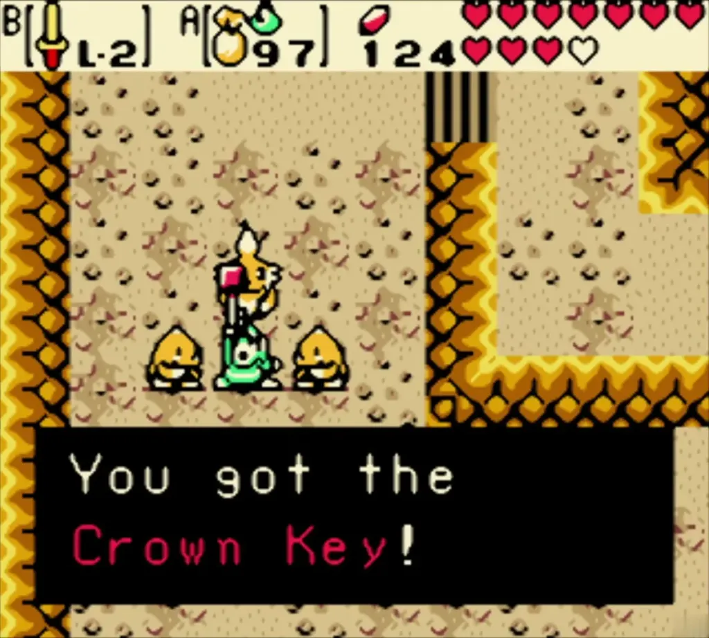 Link holding up the Crown Key in the Goron Elder's cave Link holding up the Crown Key in the Goron Elder's cave