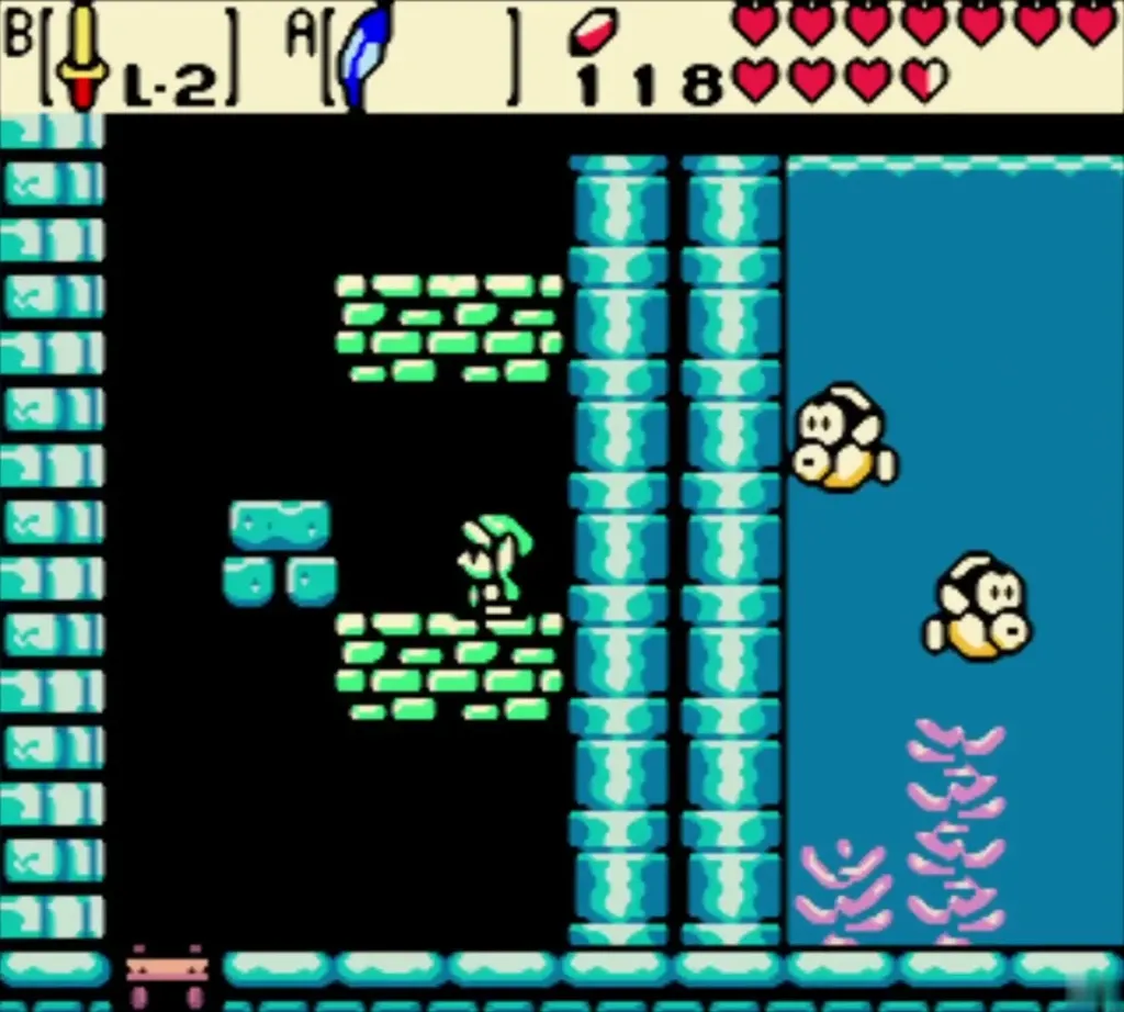 Link on a ledge above the water with two fish swimming below Link on a ledge above the water with two fish swimming below