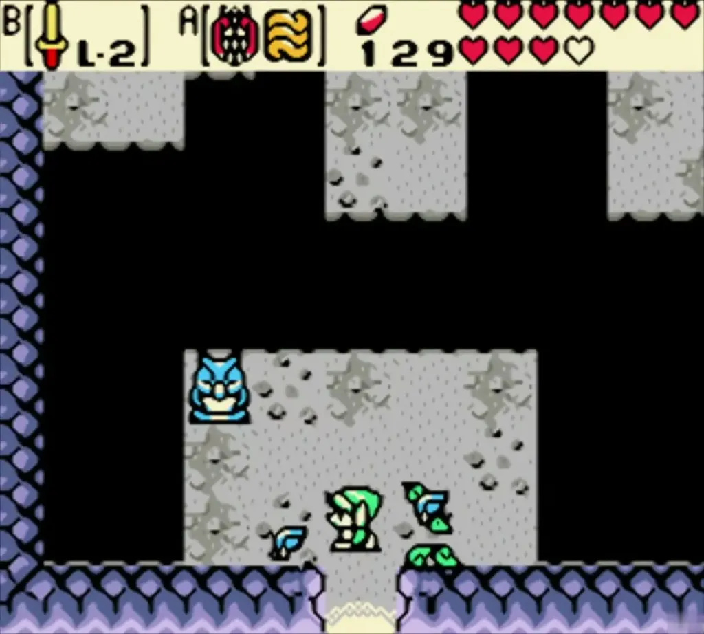 Link back in the grey cave beside the owl statue in the present Link back in the grey cave beside the owl statue in the present
