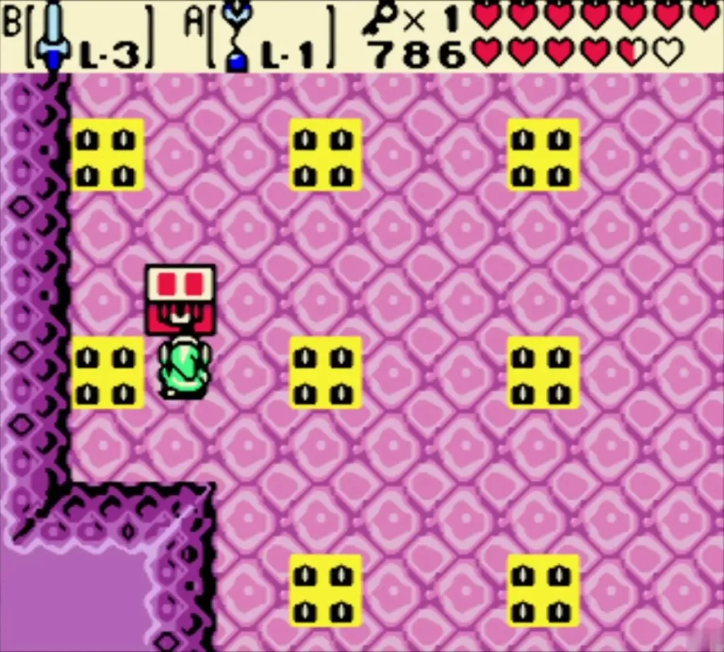 Link facing a closed red chest in the pink room with yellow spike tiles Link facing a closed red chest in the pink room with yellow spike tiles