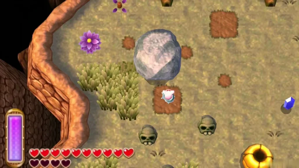 A Maiamai patch beside a large grey rock with two skulls, tall grass and a purple flower on Lorule's ground A Maiamai patch beside a large grey rock with two skulls, tall grass and a purple flower on Lorule's ground