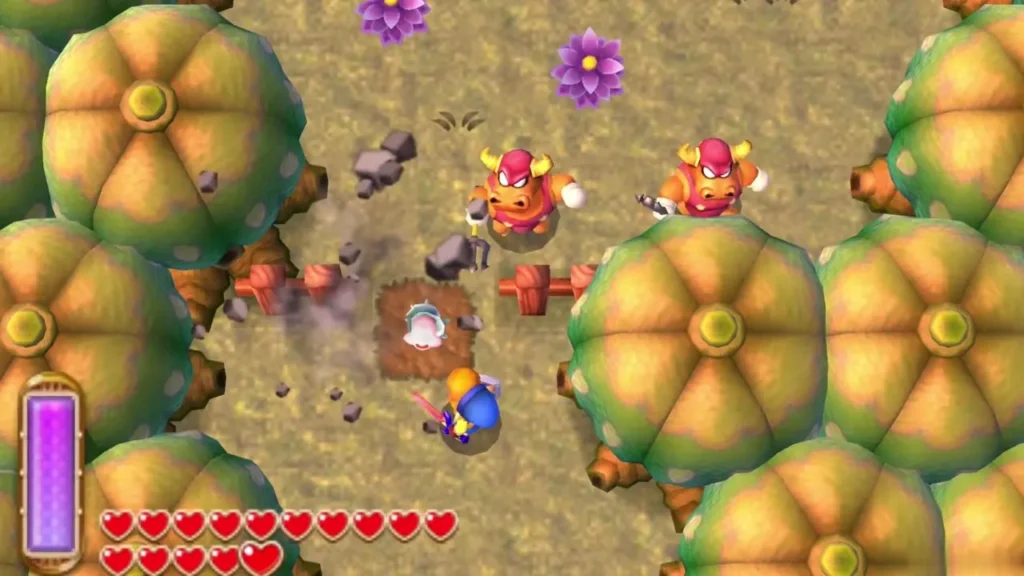 Link on a dirt patch in a clearing of round trees as a lifted large rock shatters, a Maiamai rising from the hole Link on a dirt patch in a clearing of round trees as a lifted large rock shatters, a Maiamai rising from the hole
