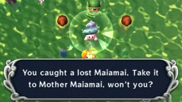 Link holds up a caught lost Maiamai in a bubble among brown rock stumps in Lorule Lake, with the catch message box