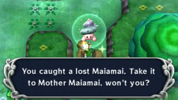 Link catching a lost Maiamai in a grassy clearing beside a round green tree, with the catch message fully shown