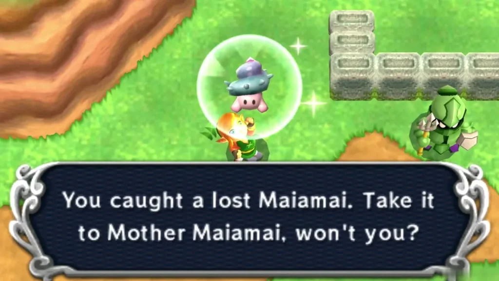 Link holding up a caught lost Maiamai in a bubble on grass below a cliff, the catch message complete Link holding up a caught lost Maiamai in a bubble on grass below a cliff, the catch message complete