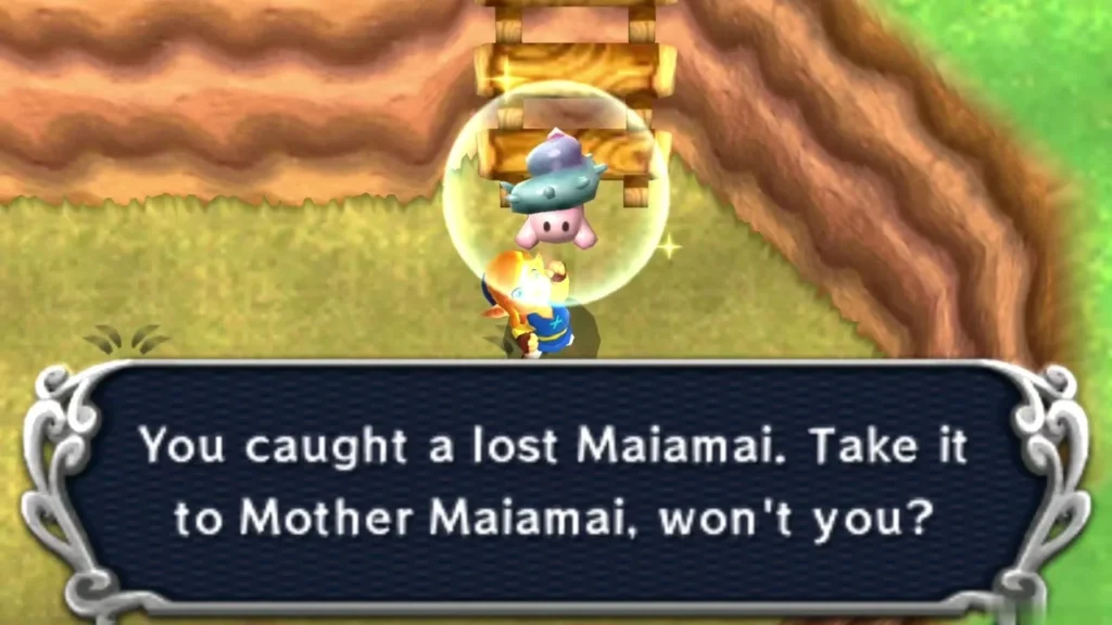 Link holding up a caught lost Maiamai in a bubble on grass below a wooden ladder, the catch message complete Link holding up a caught lost Maiamai in a bubble on grass below a wooden ladder, the catch message complete