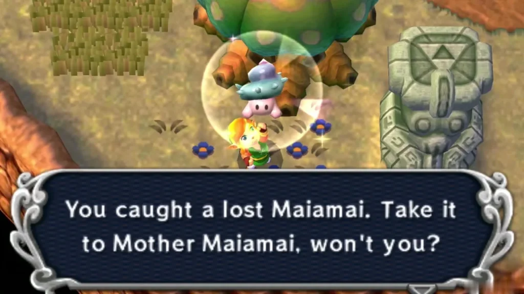 Link holding up a caught lost Maiamai in a bubble beside a tree and a stone face statue, the catch message complete Link holding up a caught lost Maiamai in a bubble beside a tree and a stone face statue, the catch message complete