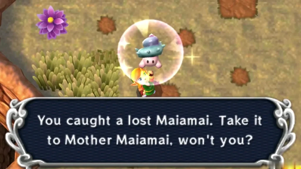 Link holding up a caught lost Maiamai in a bubble beside tall grass and a brown cliff, the catch message complete Link holding up a caught lost Maiamai in a bubble beside tall grass and a brown cliff, the catch message complete