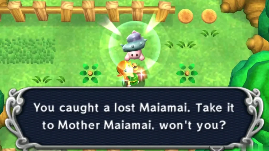 Link holding up a caught lost Maiamai in a bubble in a fenced green clearing, the catch message complete Link holding up a caught lost Maiamai in a bubble in a fenced green clearing, the catch message complete