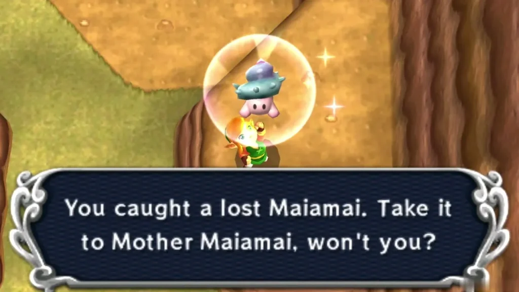 Link holding up a caught lost Maiamai in a bubble on a dirt platform above the water, the catch message complete Link holding up a caught lost Maiamai in a bubble on a dirt platform above the water, the catch message complete
