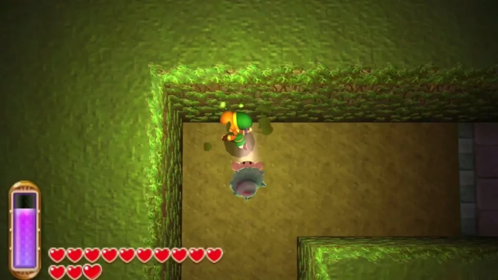Link merged into a moss-covered green stone wall with a lost Maiamai floating beside him Link merged into a moss-covered green stone wall with a lost Maiamai floating beside him