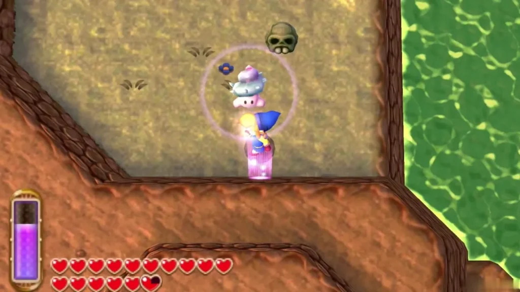 Link stepping out of a cliff wall onto a plateau with a skull and a freed Maiamai above the green lake Link stepping out of a cliff wall onto a plateau with a skull and a freed Maiamai above the green lake