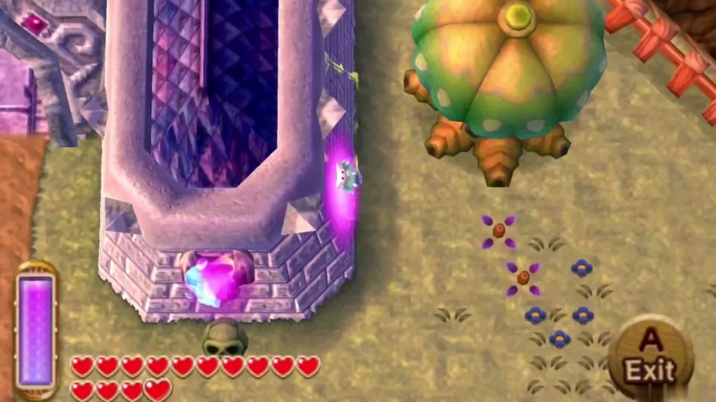 Link merged beside a purple stone tower with a skull below it and a lost Maiamai glowing at its edge, the Exit prompt showing Link merged beside a purple stone tower with a skull below it and a lost Maiamai glowing at its edge, the Exit prompt showing