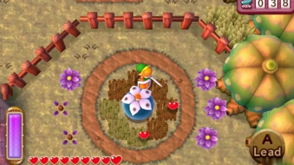 Link stands with his sword drawn inside the ring of grass around the Big Bomb Flower