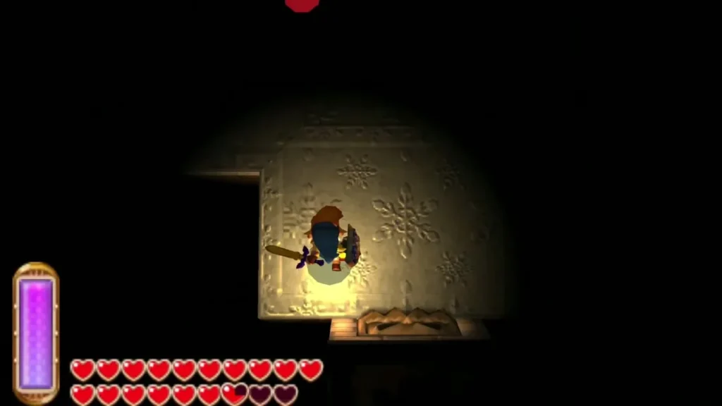 Link lit only by his Lamp in a dark room with a chest on the floor