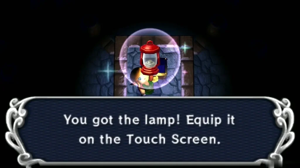 Link holding up the Lamp under the 'You got the lamp! Equip it on the Touch Screen.' message box Link holding up the Lamp under the 'You got the lamp! Equip it on the Touch Screen.' message box