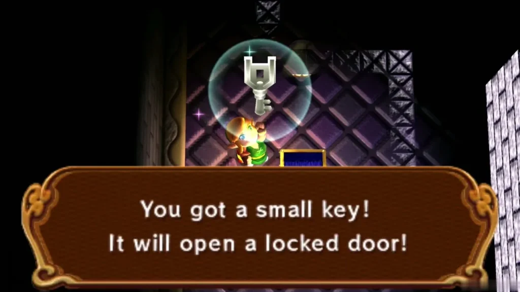 Link holds up a Small Key beneath the 'You got a small key!' message Link holds up a Small Key beneath the 'You got a small key!' message