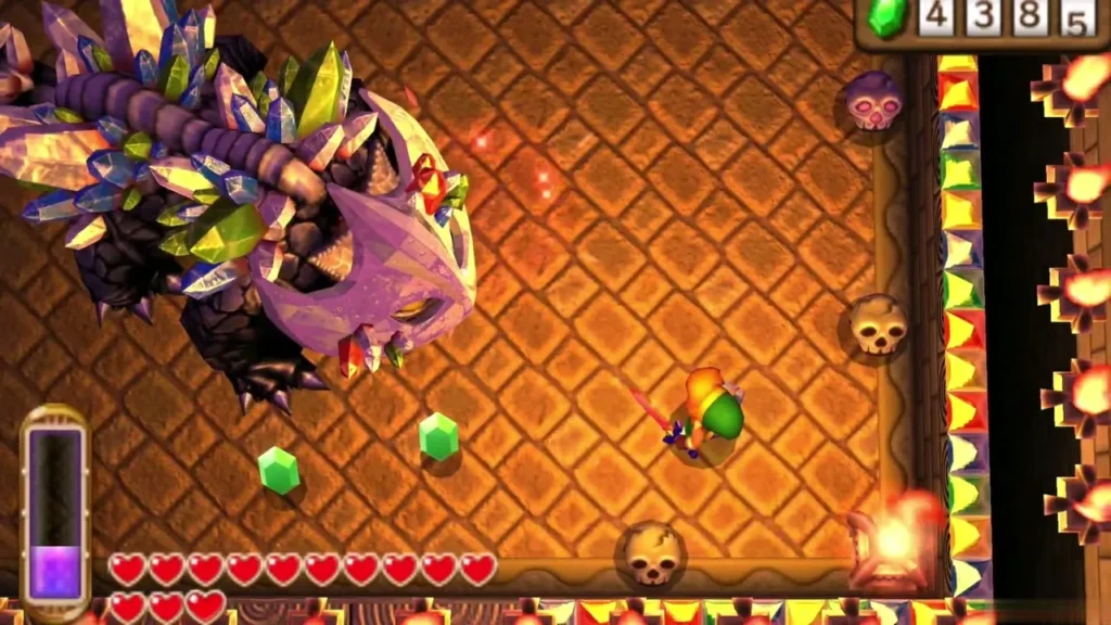 Link fighting the Gemesaur King beside the arena wall, with a green rupee on the floor Link fighting the Gemesaur King beside the arena wall, with a green rupee on the floor