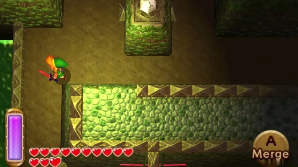Link beside a stone wall in the Dark Ruins, with the Merge prompt on screen Link beside a stone wall in the Dark Ruins, with the Merge prompt on screen