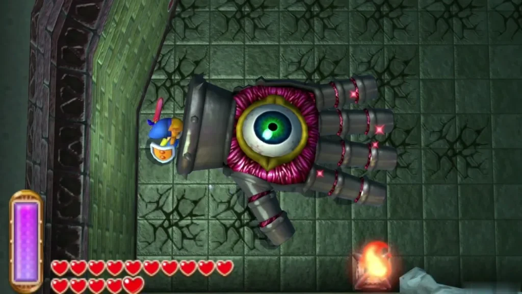 Knucklemaster hand stunned against the wall with its green eye exposed Knucklemaster hand stunned against the wall with its green eye exposed