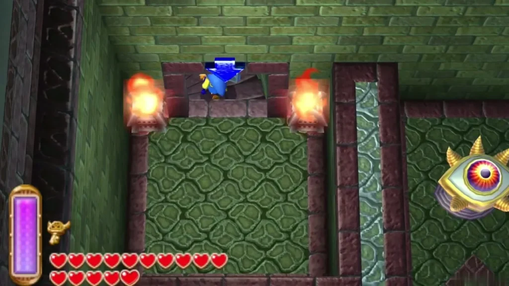 Link in the doorway between two torches leading into the dark boss arena Link in the doorway between two torches leading into the dark boss arena