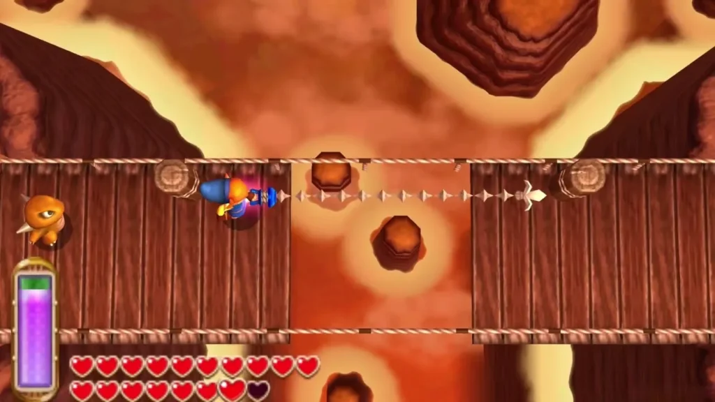 Link fires the Hookshot across a broken rope bridge on Death Mountain Link fires the Hookshot across a broken rope bridge on Death Mountain