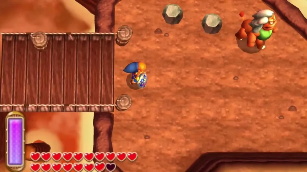 Link lands on solid ground beyond the broken rope bridge on Death Mountain Link lands on solid ground beyond the broken rope bridge on Death Mountain