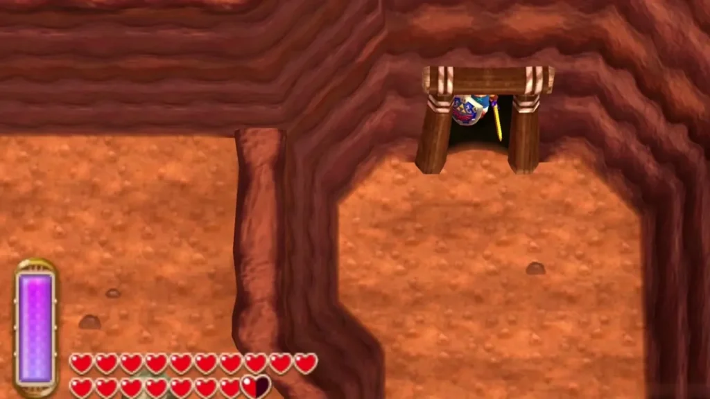 Link stands in the wooden mine doorway at the end of the lava cave Link stands in the wooden mine doorway at the end of the lava cave