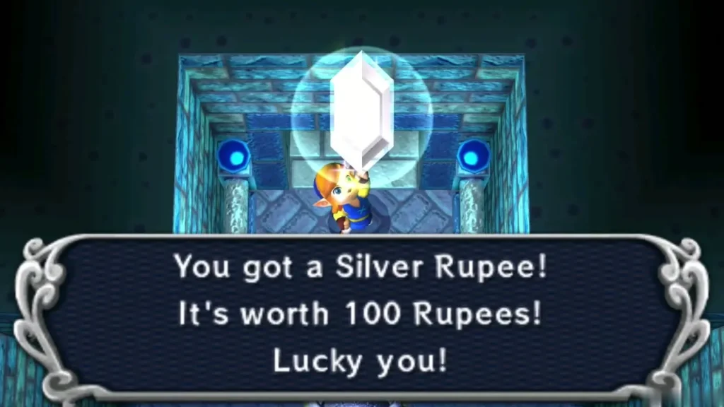 Link holding up a Silver Rupee with the message that it is worth 100 Rupees Link holding up a Silver Rupee with the message that it is worth 100 Rupees