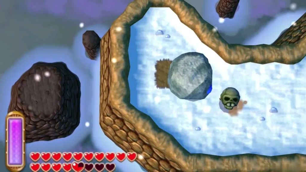 A skull sits on a snowy ledge beside a grey boulder, ready to be smashed A skull sits on a snowy ledge beside a grey boulder, ready to be smashed