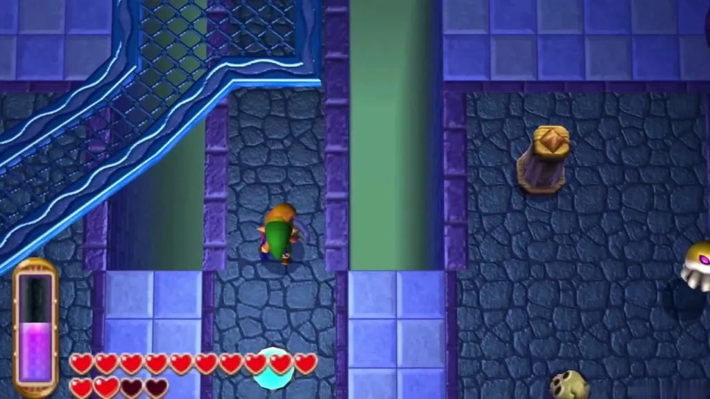 Link walks past a bronze chest on a ledge beside the B1 water channel Link walks past a bronze chest on a ledge beside the B1 water channel