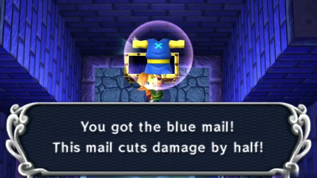 Link holding up the Blue Mail with the box saying it cuts damage by half Link holding up the Blue Mail with the box saying it cuts damage by half