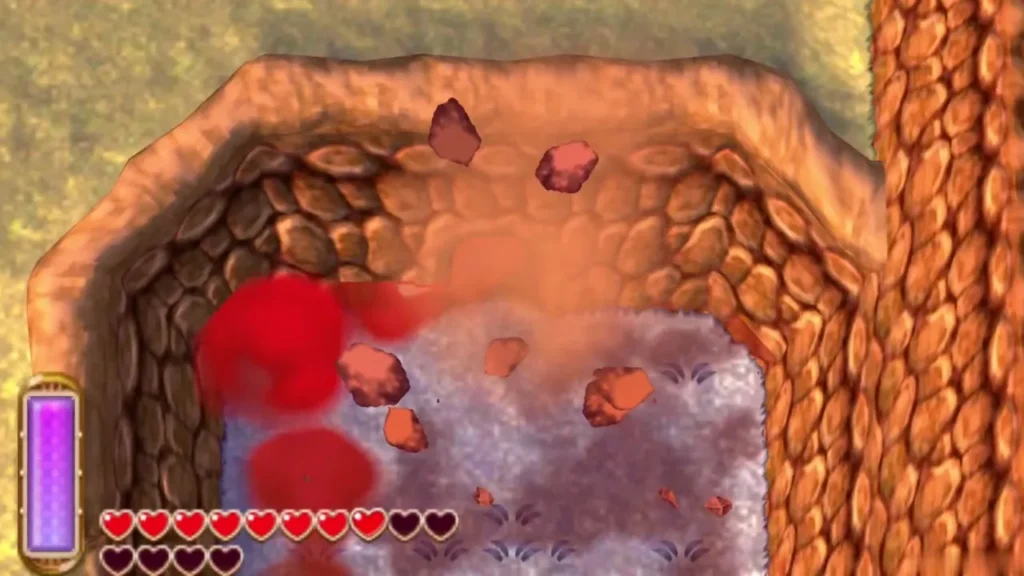 Red blast breaks a boulder in a Lorule rock wall, opening the cave behind it Red blast breaks a boulder in a Lorule rock wall, opening the cave behind it