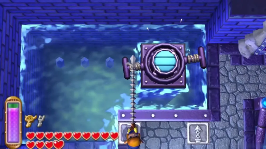 Link using the Hookshot beneath a round ornate door set high above the flooded hall Link using the Hookshot beneath a round ornate door set high above the flooded hall