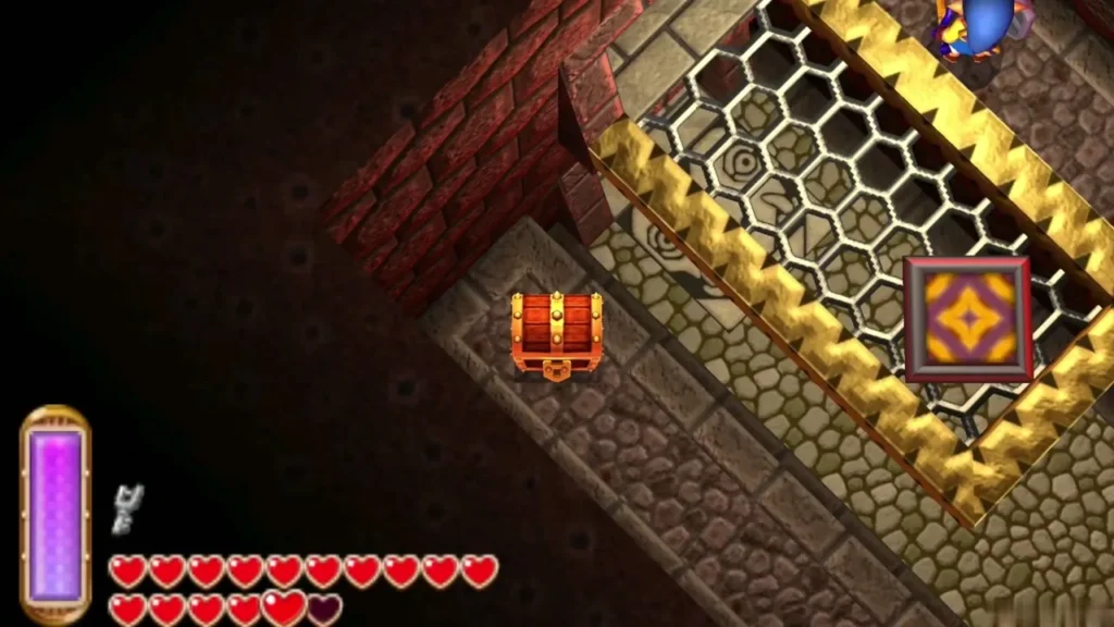 A closed chest on a stone ledge beside a grated floor with gold edging A closed chest on a stone ledge beside a grated floor with gold edging