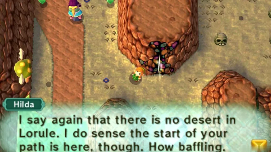 Hilda's dialogue box says the start of Link's path is here, as he stands by a crystal-studded rock cave in Lorule Hilda's dialogue box says the start of Link's path is here, as he stands by a crystal-studded rock cave in Lorule