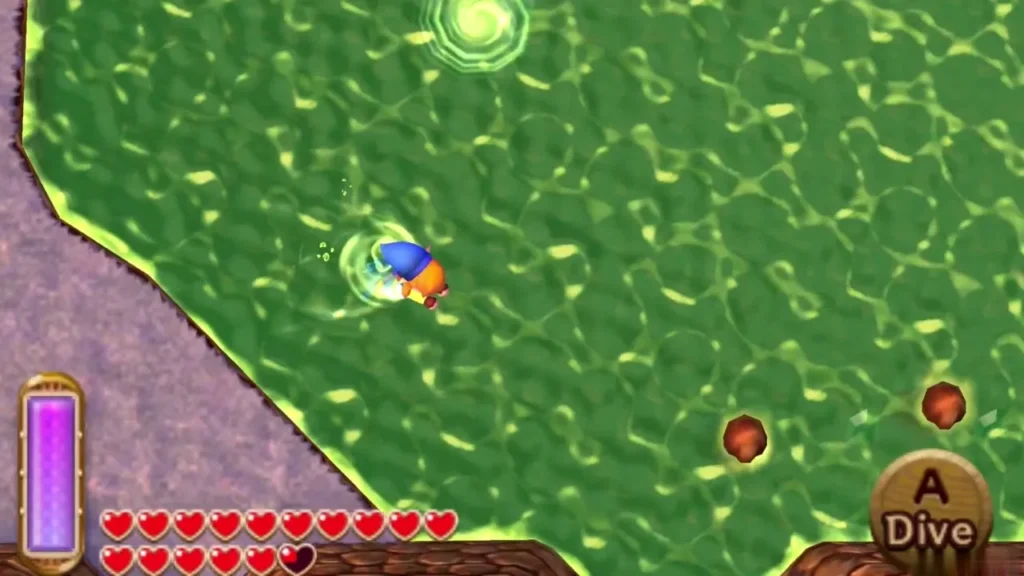 Link diving into Lorule Lake with the Dive prompt on screen Link diving into Lorule Lake with the Dive prompt on screen