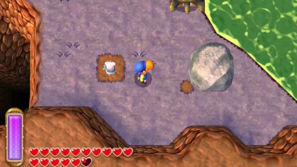 Lost Maiamai sitting in a dirt mound on the lake shore beside Link Lost Maiamai sitting in a dirt mound on the lake shore beside Link