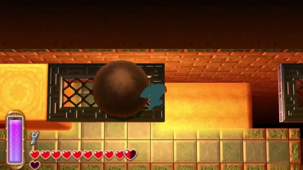 A large brown ball rolling along a sandy corridor past a grated window A large brown ball rolling along a sandy corridor past a grated window