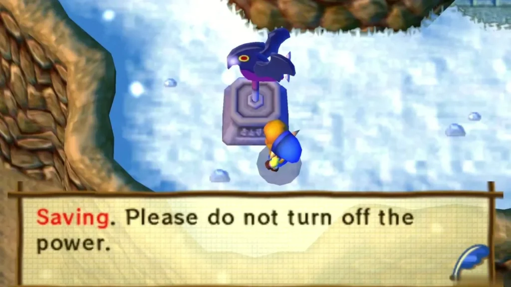 Link saving at the bird statue on the snowy path, with the saving message box shown Link saving at the bird statue on the snowy path, with the saving message box shown