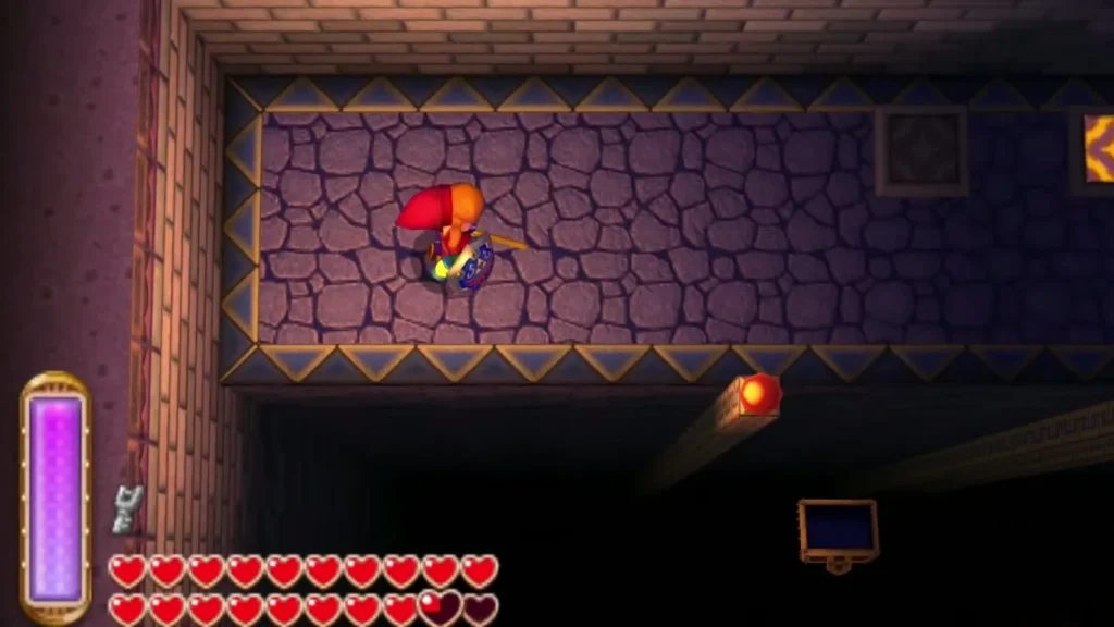 Link in a torch-lit stone room with a chest in the lower corner Link in a torch-lit stone room with a chest in the lower corner