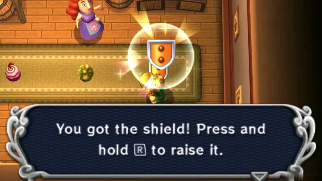 Link holds the Shield up in the item shop with the 'You got the shield' message Link holds the Shield up in the item shop with the 'You got the shield' message