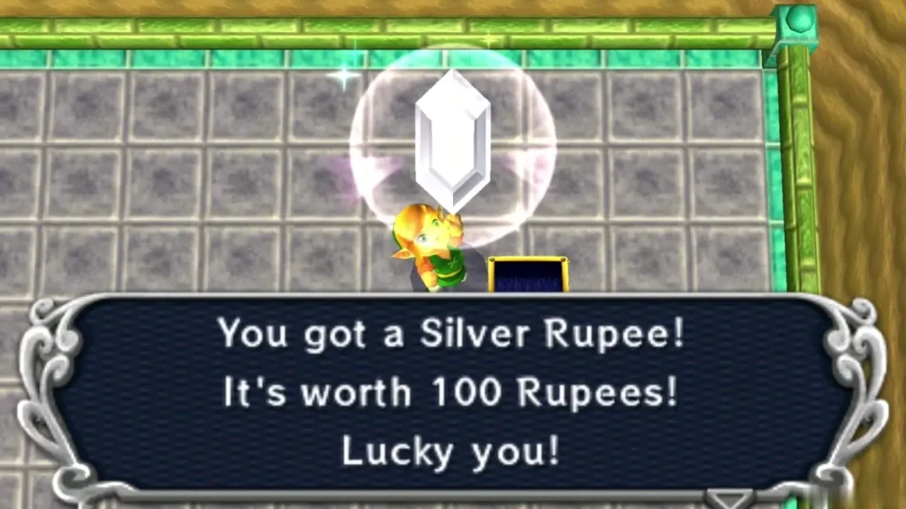 Link holding up a Silver Rupee with the message that it is worth 100 Rupees Link holding up a Silver Rupee with the message that it is worth 100 Rupees