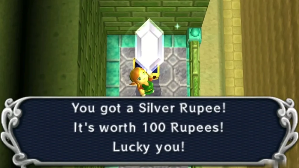 Link holding up a Silver Rupee under the 'worth 100 Rupees' message Link holding up a Silver Rupee under the 'worth 100 Rupees' message