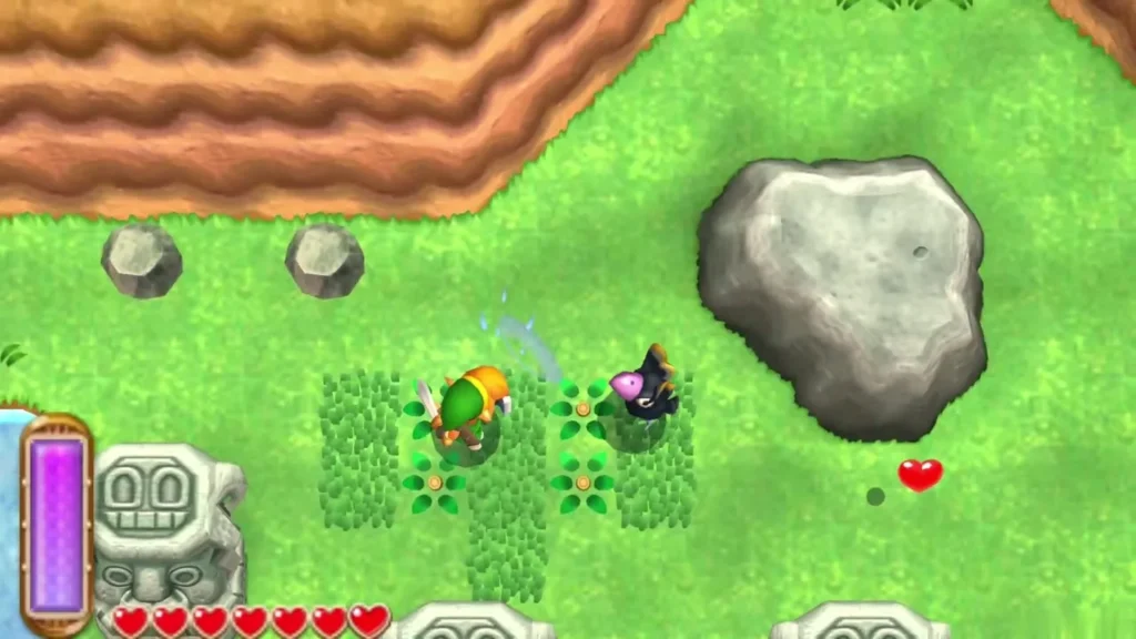 Link slashing grass beside a Maiamai near a large grey boulder Link slashing grass beside a Maiamai near a large grey boulder