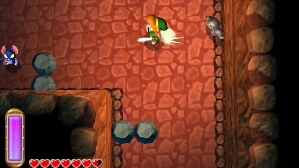 Link in the red-stone cave room with a Maiamai at the left edge Link in the red-stone cave room with a Maiamai at the left edge
