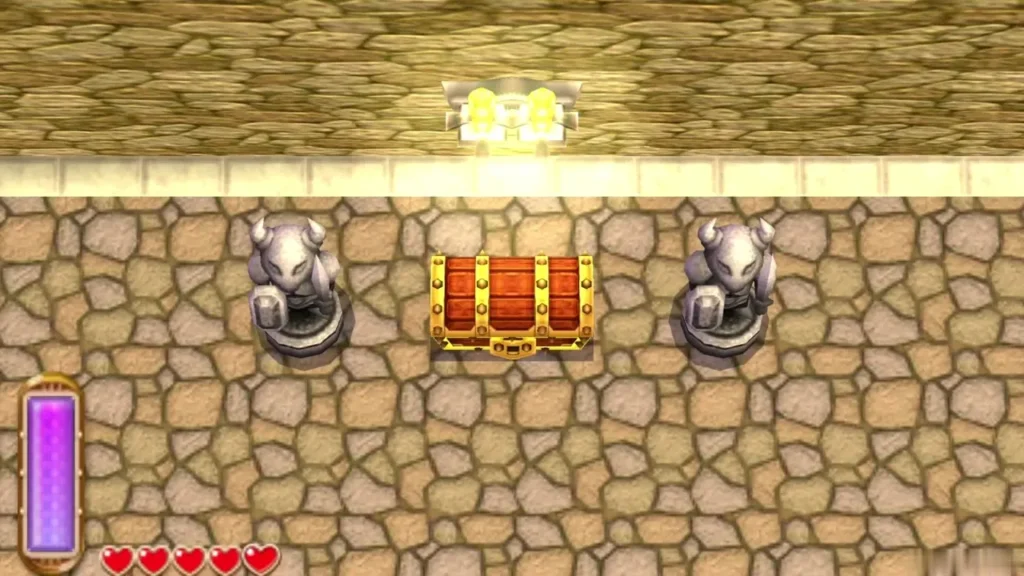 Large chest appearing between two stone Armos statues on the outer ledge Large chest appearing between two stone Armos statues on the outer ledge