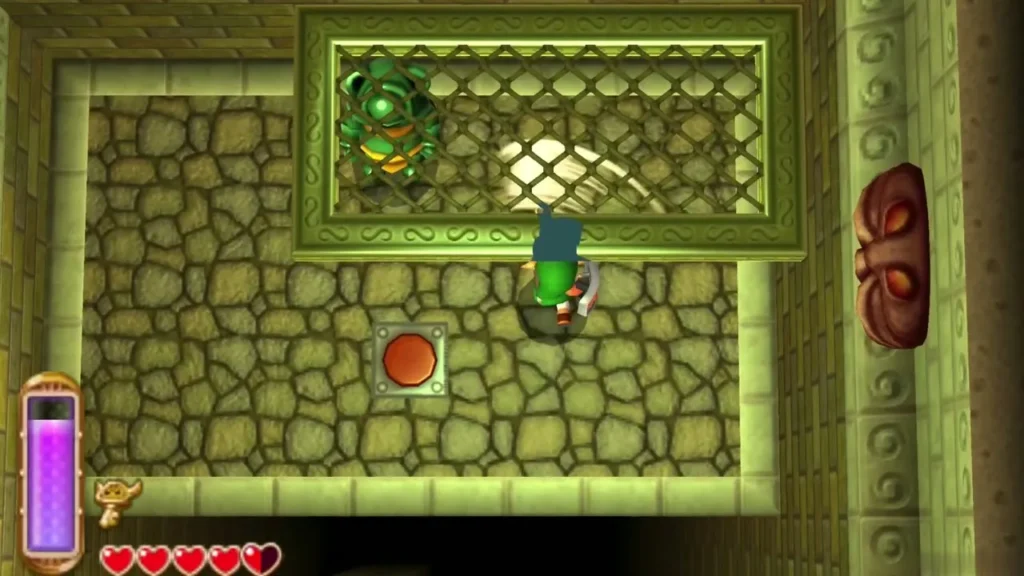 Link slashing at a green Eyegore behind a grate in the room with a floor button Link slashing at a green Eyegore behind a grate in the room with a floor button